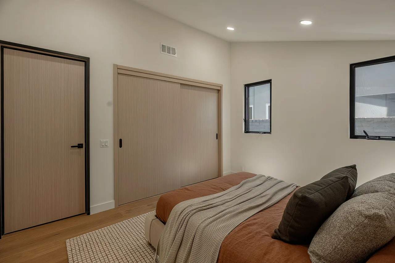 A light-toned room door with a contrasting dark frame.