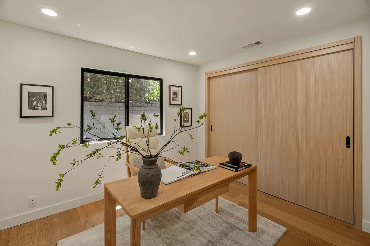 Wide matching closet doors in the home office.