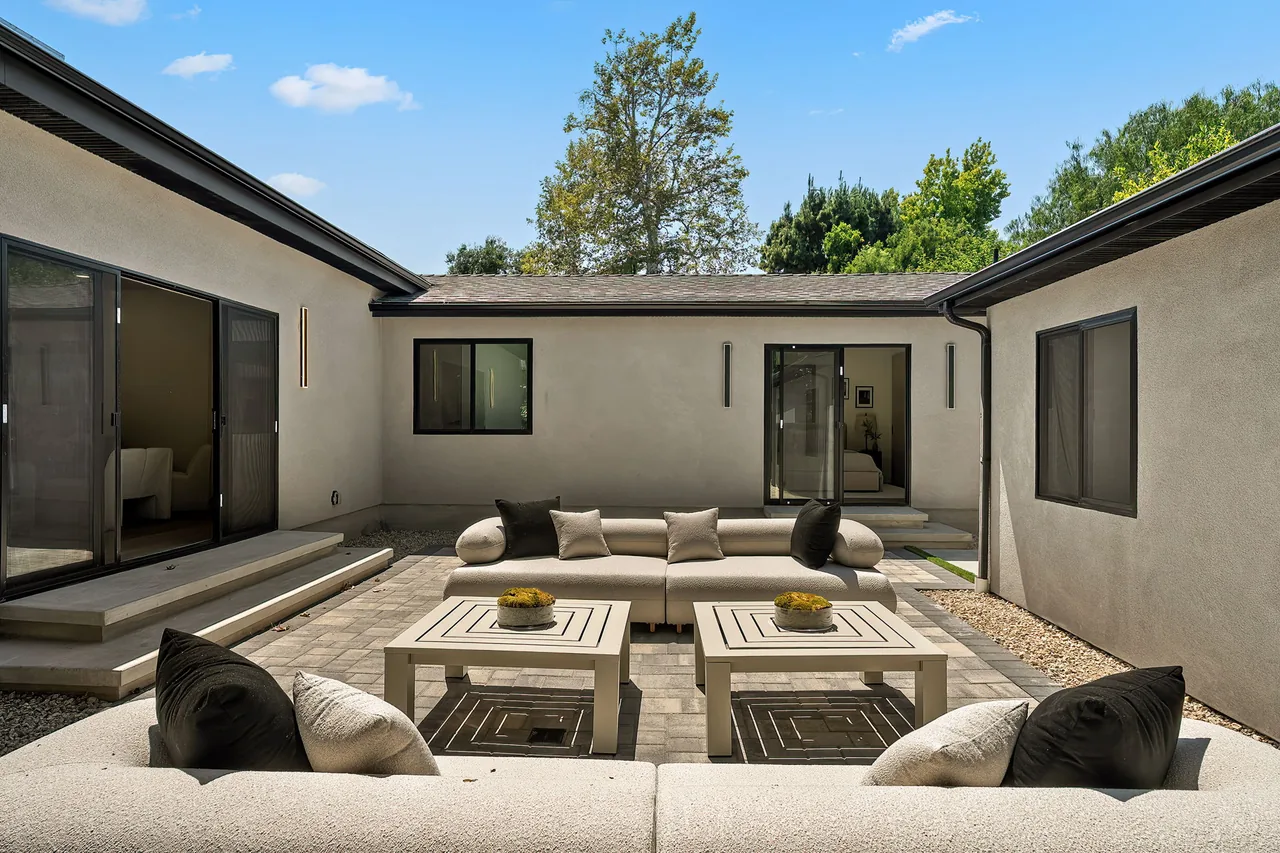 Glazed openings around the finished outdoor living space.