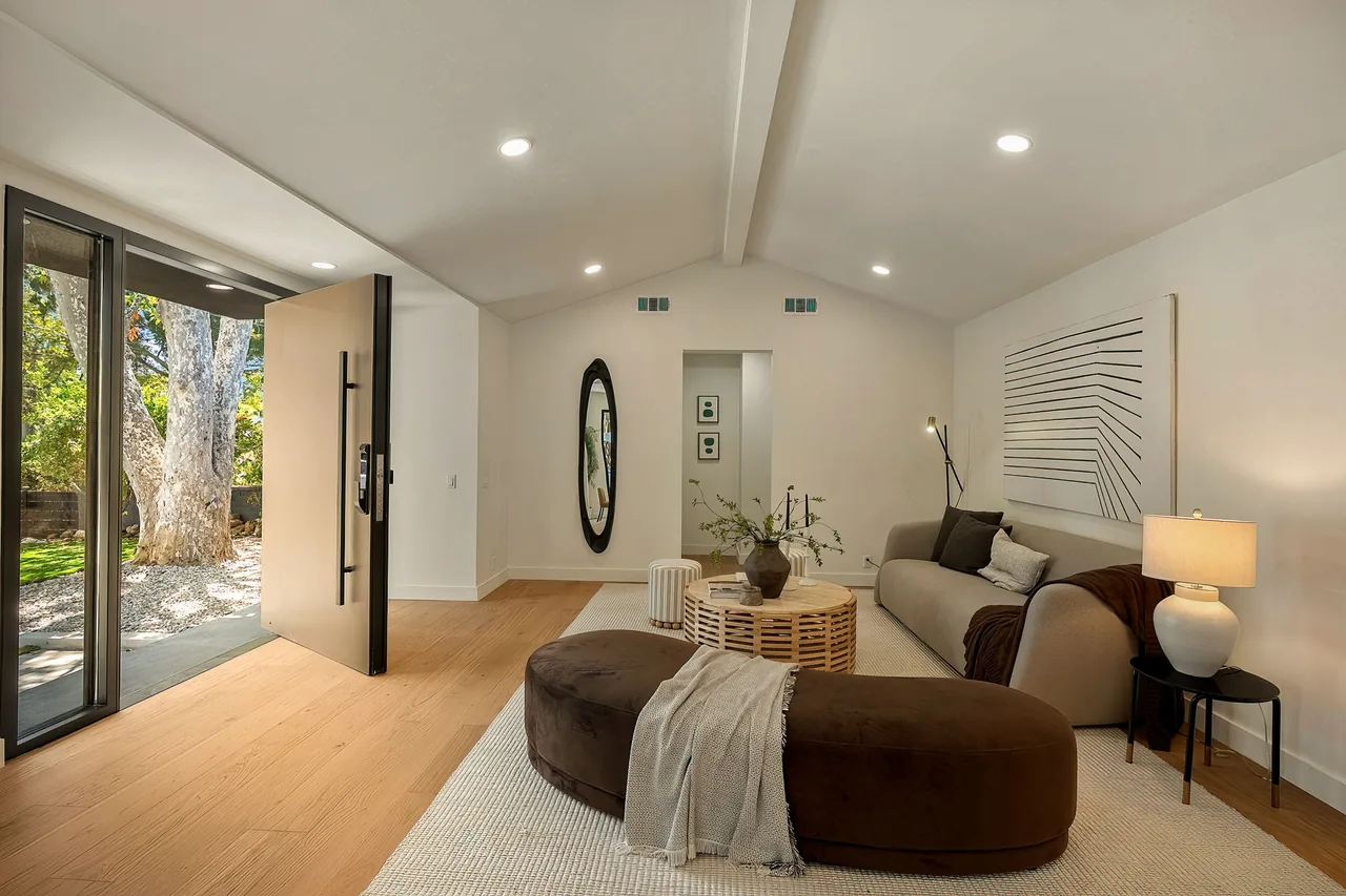 The entry door and full-height sidelights viewed from the living room.