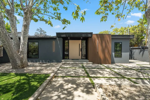 The completed Hartsook Street home with its pivot entrance and black-framed windows