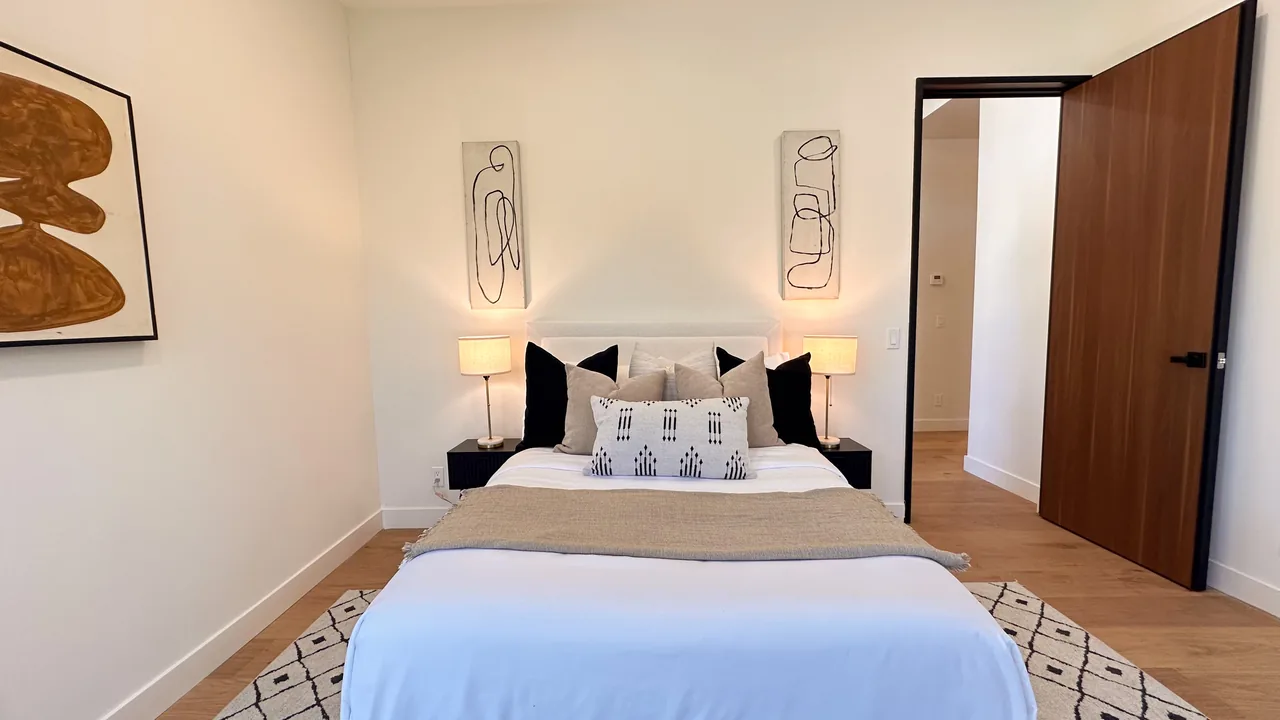 A wood-toned interior door in the finished bedroom.