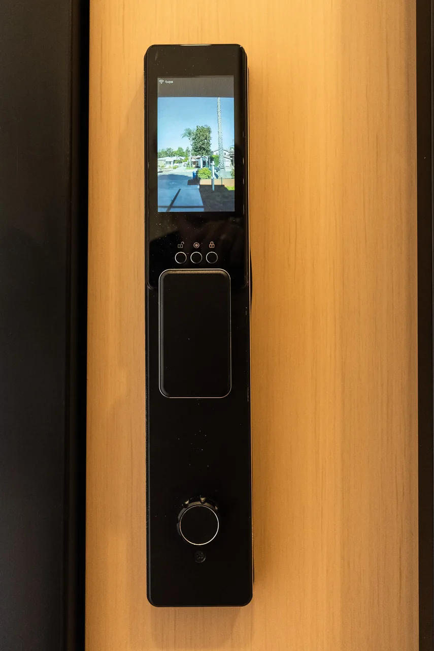 A close view of the electronic lock on the entry door.