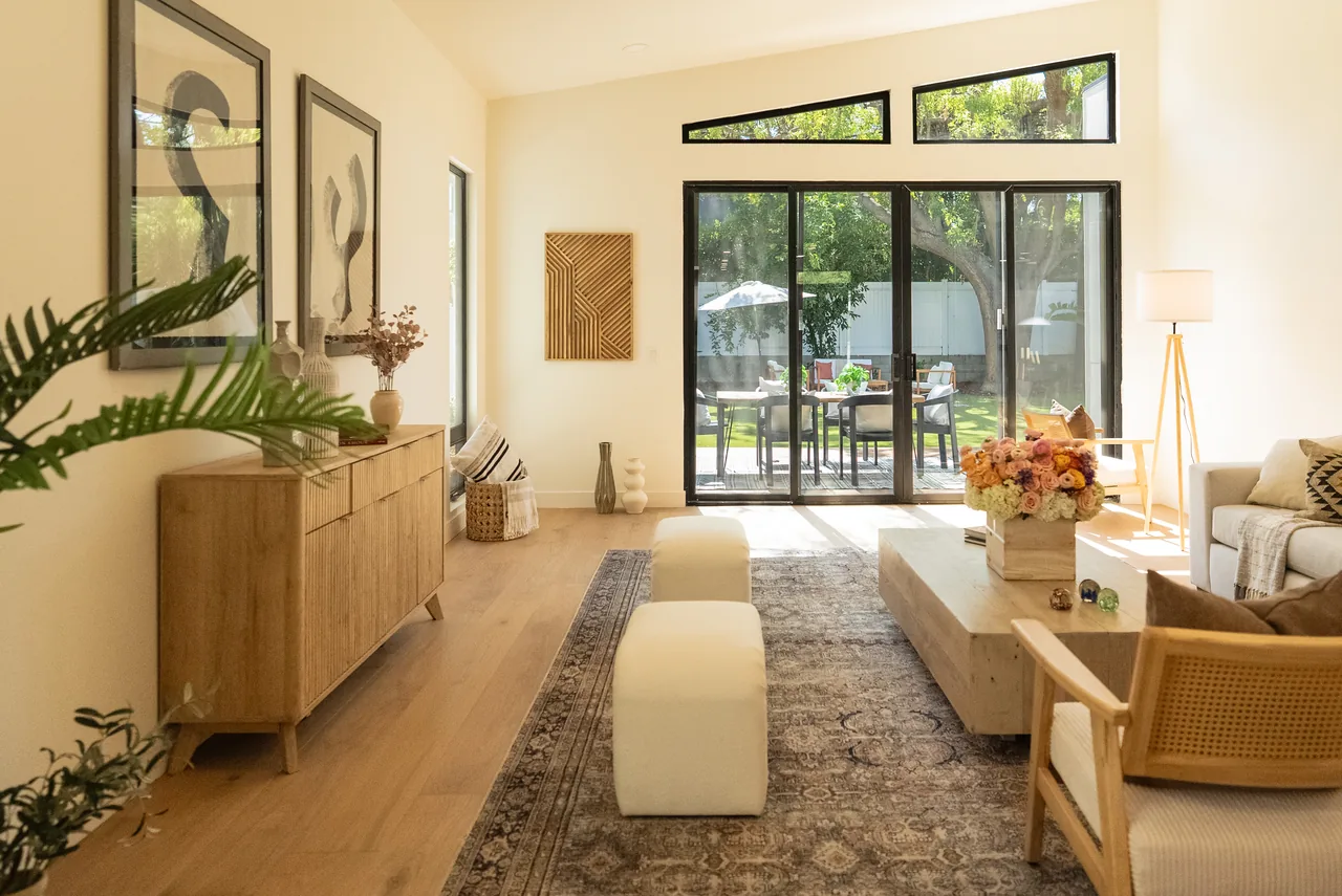 The garden-facing glazed opening and high windows in the living room.